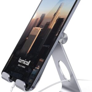 Modern tablet on silver adjustable charging stand